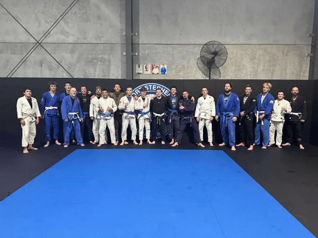 Port Stephens BJJ students and coaches lined up on the mats